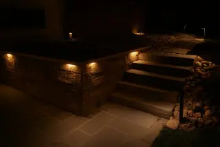 Path lighting guiding movement along stone terraces