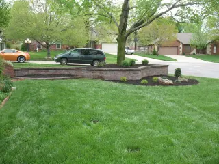 Stone retaining wall bordering an outdoor living space